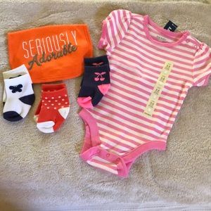 Old Navy Onesie, Bibb, and three pairs of unworn socks